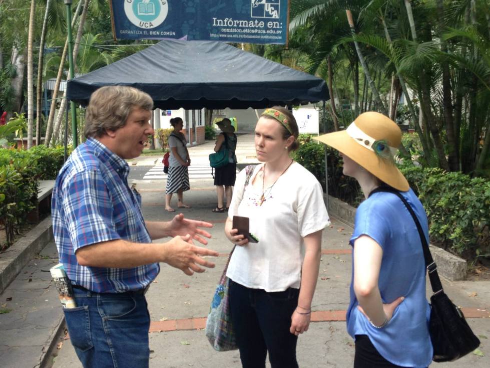 Father John Dear speaking with Meg Stplpeton Smith (center) and Christine McCarthy (right). Photo credit: James T. Keane.