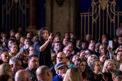 A heckler interrupts President Barack Obama’s remarks on immigration reform at the Copernicus Center in Chicago, Nov. 25, 2014. Obama acknowledged the hecklers at an event in which he also addressed the events in Ferguson, Mo., saying that he had no sympathy for looters while praising demonstrators who remained peaceful. (Jabin Botsford/The New York Times)